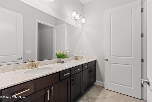 bathroom with tile patterned flooring and vanity