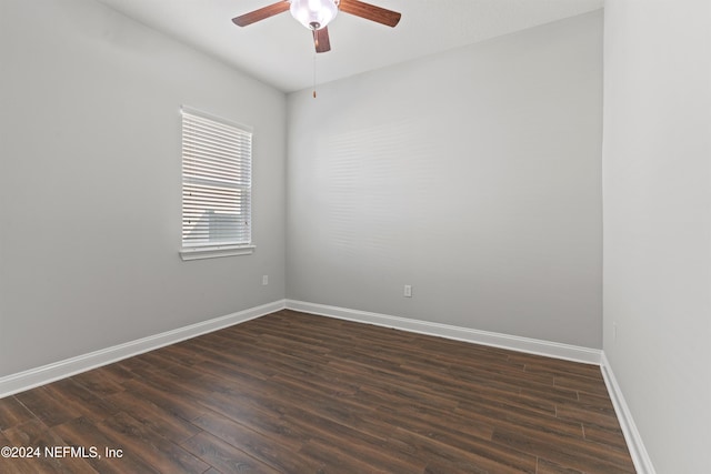 empty room featuring ceiling fan and dark hardwood / wood-style floors