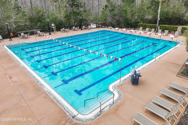 view of swimming pool featuring a patio area