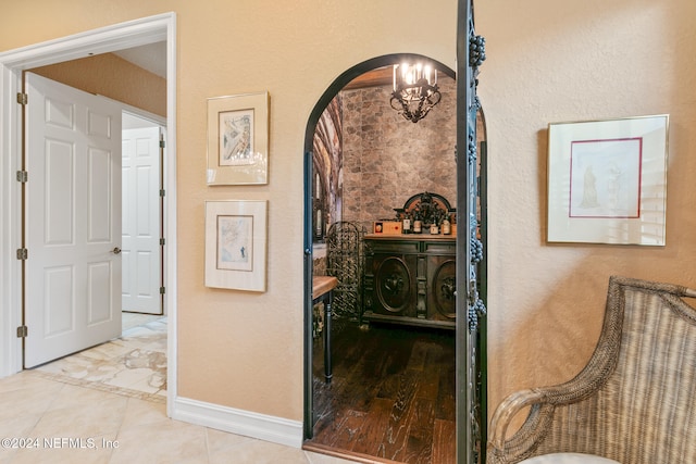 corridor with a chandelier