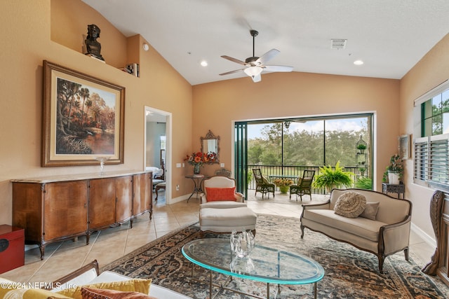 living room featuring light tile patterned flooring, ceiling fan, and high vaulted ceiling