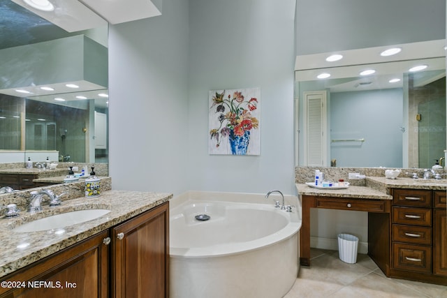 bathroom with shower with separate bathtub, tile patterned floors, and vanity