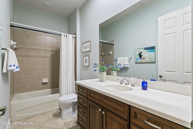 full bathroom with shower / tub combo with curtain, vanity, toilet, and tile patterned floors