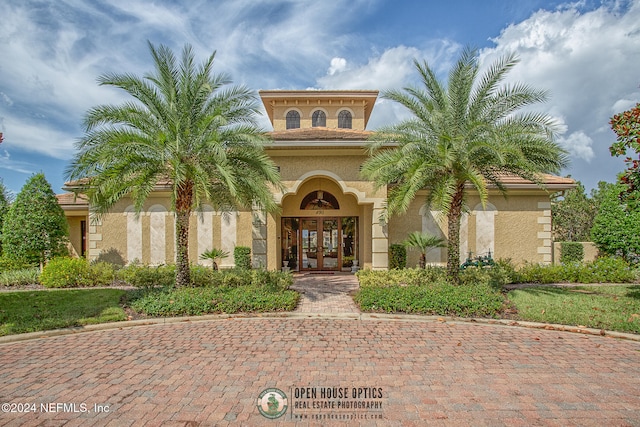 entrance to property featuring french doors