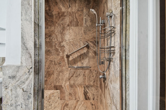 details with a tile shower