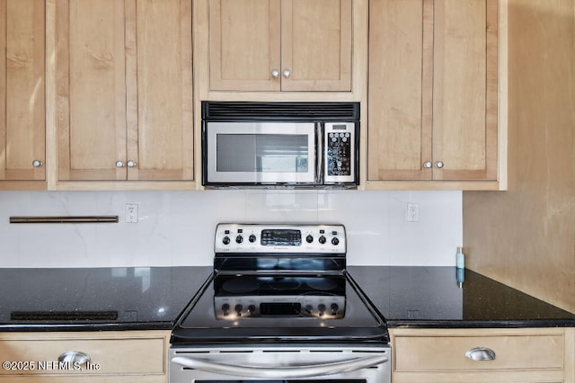 kitchen featuring appliances with stainless steel finishes, dark stone counters, decorative backsplash, and light brown cabinetry