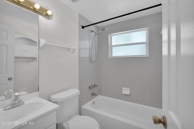 full bathroom featuring vanity, toilet, and tiled shower / bath