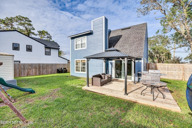 back of house with an outdoor hangout area, a yard, and a gazebo