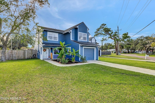 view of front property with a front yard and a garage