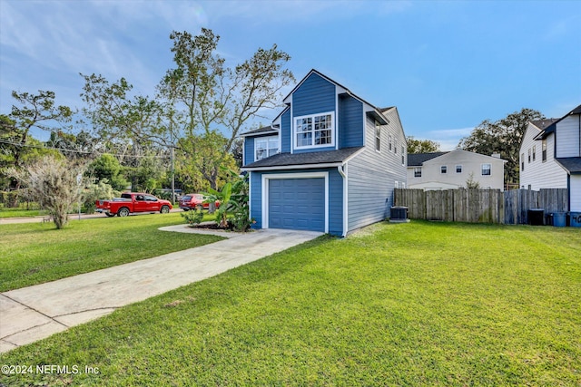 view of front facade featuring a front lawn and a garage