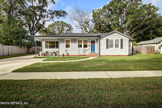 ranch-style house with a porch and a front yard