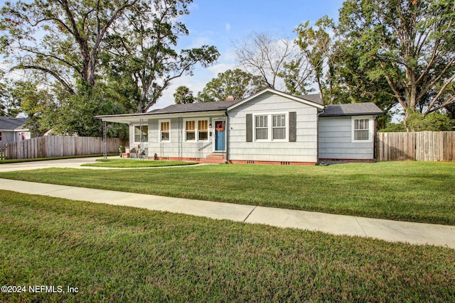 ranch-style house with a front lawn