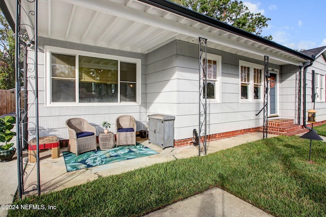 view of property exterior featuring a yard and covered porch