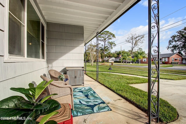 view of patio featuring a porch