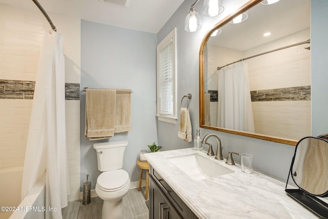 full bathroom with vanity, toilet, and shower / bath combo