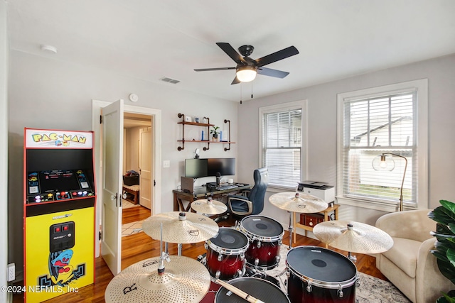 interior space featuring ceiling fan and hardwood / wood-style flooring