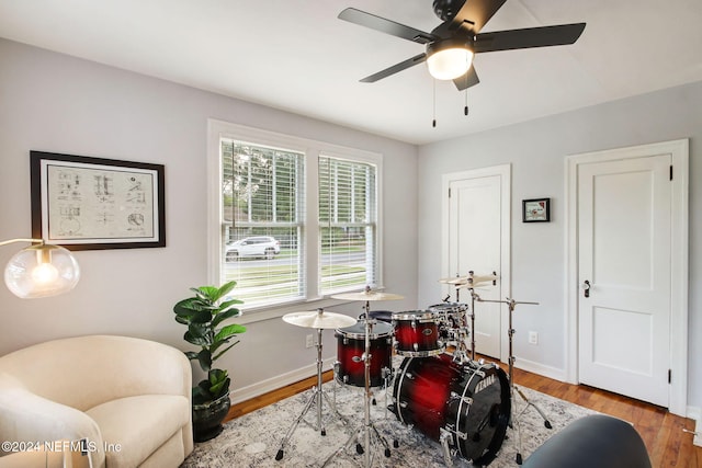 game room with ceiling fan and hardwood / wood-style flooring