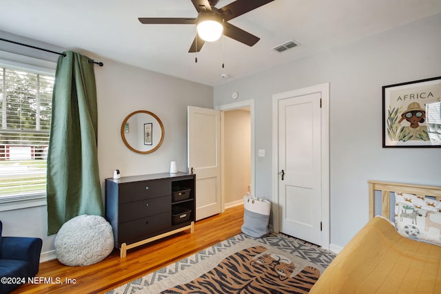 bedroom featuring light hardwood / wood-style floors and ceiling fan