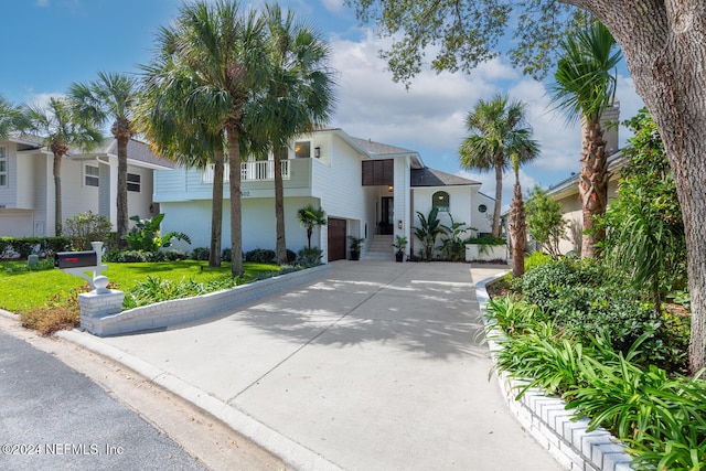 view of front of property with a garage and a front yard