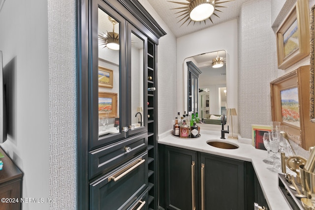 bathroom featuring ceiling fan and vanity