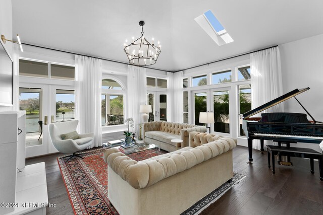 living room featuring french doors, dark hardwood / wood-style floors, and plenty of natural light