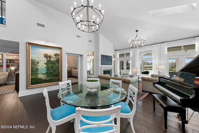 dining room featuring french doors, high vaulted ceiling, dark hardwood / wood-style floors, and a notable chandelier