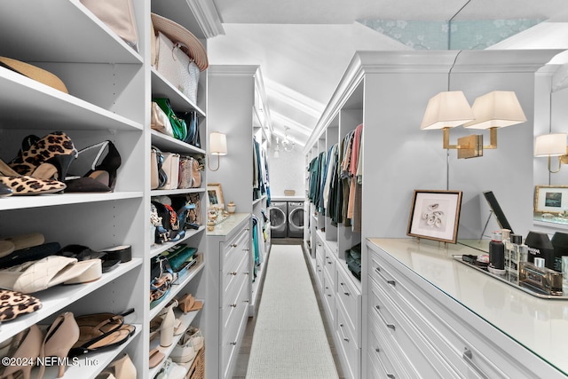 spacious closet featuring independent washer and dryer