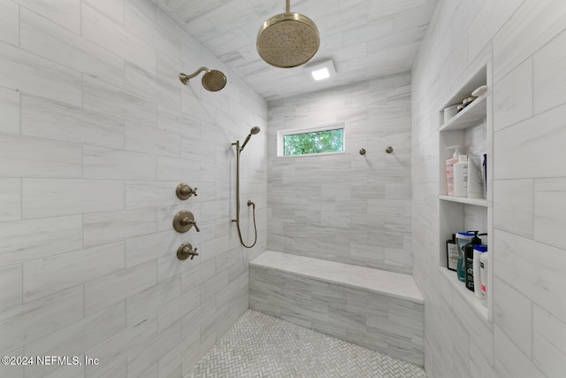 bathroom with a tile shower