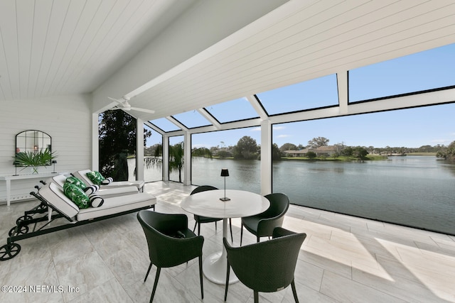 view of patio / terrace featuring ceiling fan and a water view