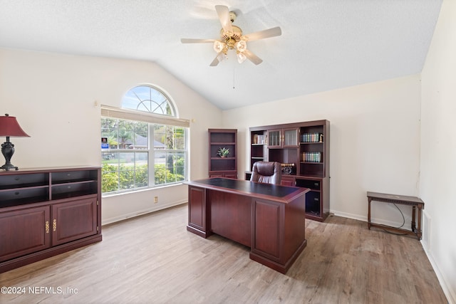 office featuring plenty of natural light, light hardwood / wood-style floors, ceiling fan, and vaulted ceiling