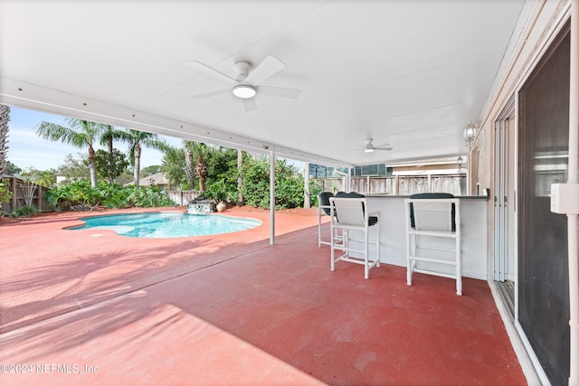 view of pool featuring ceiling fan and a patio