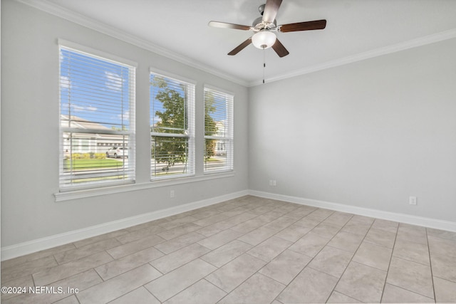 tiled empty room with ceiling fan and crown molding