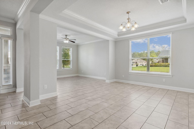 tiled empty room featuring crown molding, ceiling fan with notable chandelier, a textured ceiling, and a raised ceiling