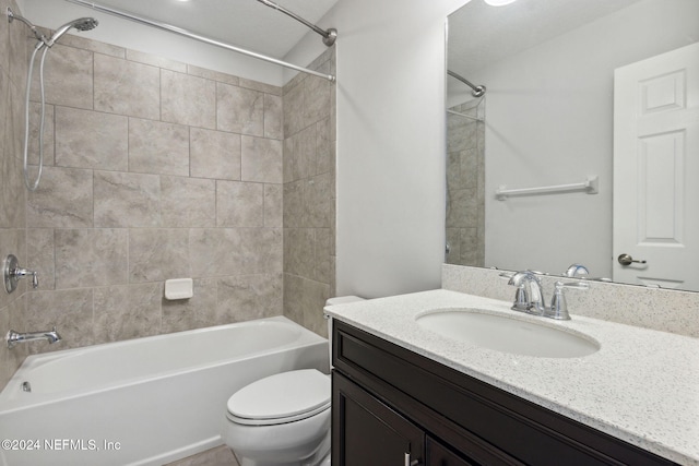 full bathroom featuring vanity, toilet, and tiled shower / bath