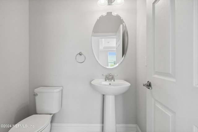 bathroom with sink and toilet