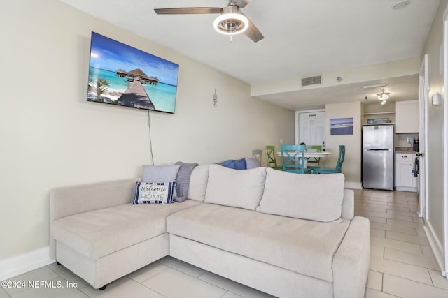 413 1st St S Unit 303, Jacksonville Beach, FL 32250 - tiled living room with ceiling fan