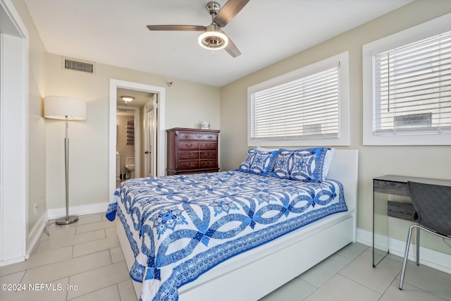 413 1st St S Unit 303, Jacksonville Beach, FL 32250 - bedroom featuring light tile patterned flooring, ceiling fan, and multiple windows