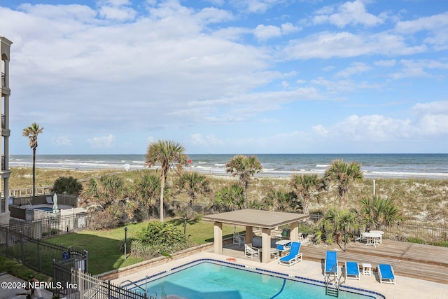 413 1st St S Unit 303, Jacksonville Beach, FL 32250 - view of pool featuring a view of the beach, a water view, and a patio