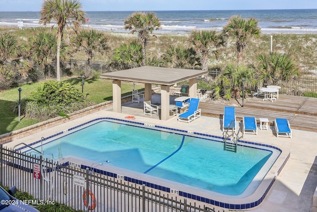 413 1st St S Unit 303, Jacksonville Beach, FL 32250 - view of swimming pool with a view of the beach, a water view, and a patio area
