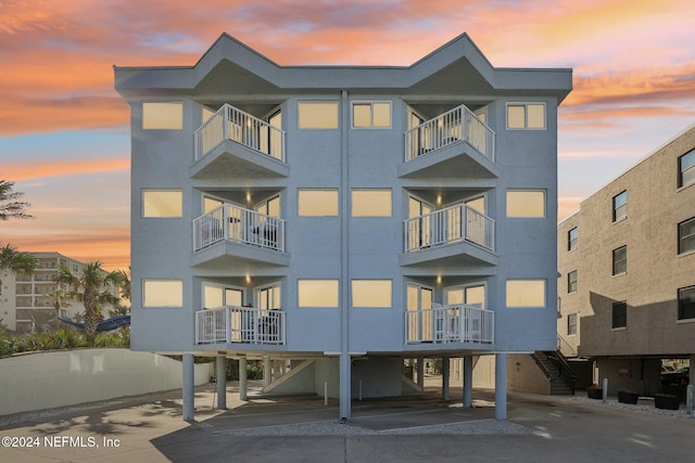 413 1st St S Unit 303, Jacksonville Beach, FL 32250 - view of outdoor building at dusk