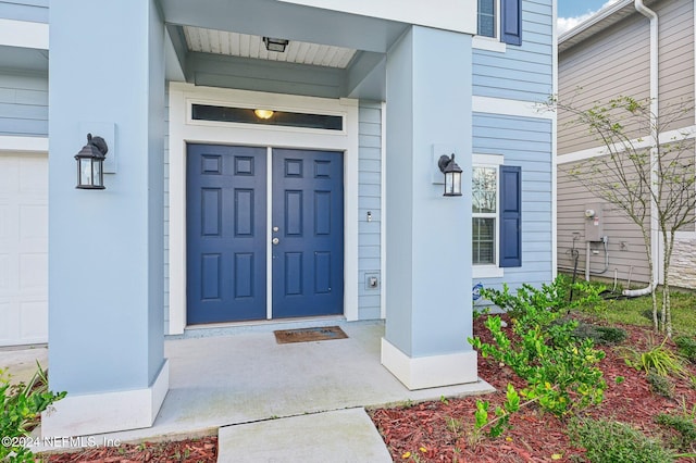 property entrance featuring a garage