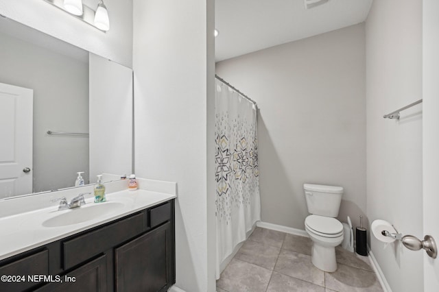 bathroom featuring tile patterned flooring, vanity, toilet, and a shower with curtain