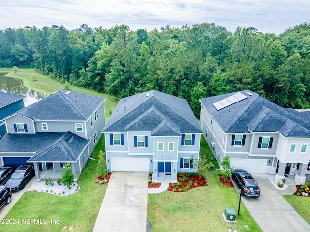 birds eye view of property with a water view