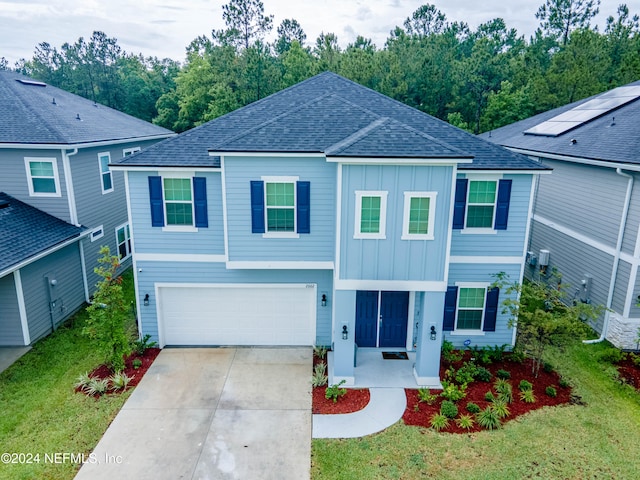 view of front facade featuring a garage and a front yard