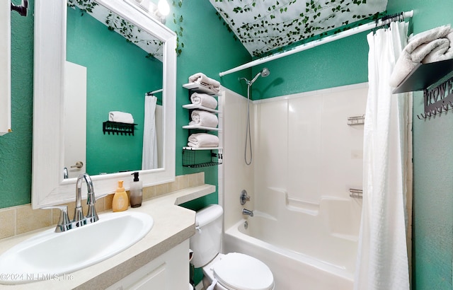 full bathroom with vanity, shower / bath combo with shower curtain, and toilet