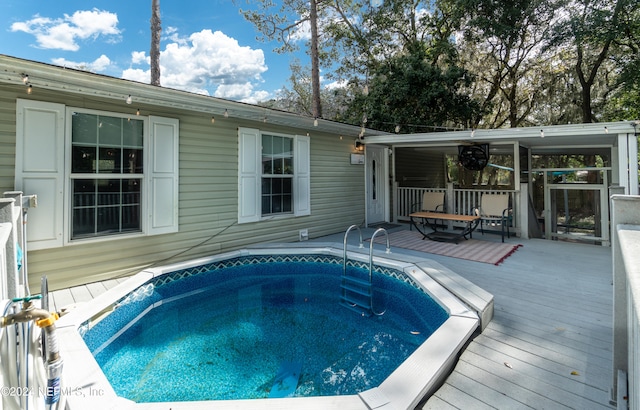 view of pool featuring a wooden deck