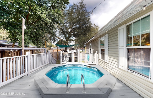 view of pool featuring a deck