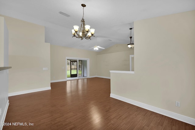 unfurnished living room featuring vaulted ceiling, dark hardwood / wood-style floors, and ceiling fan with notable chandelier