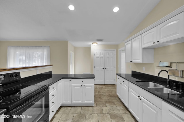 kitchen with black / electric stove, white cabinetry, kitchen peninsula, and sink