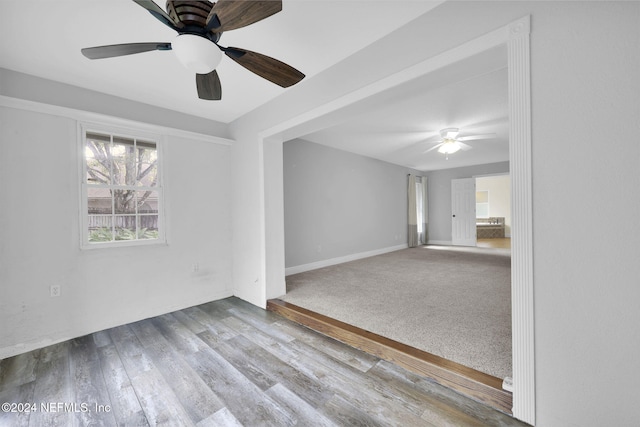 unfurnished room with hardwood / wood-style flooring and ceiling fan